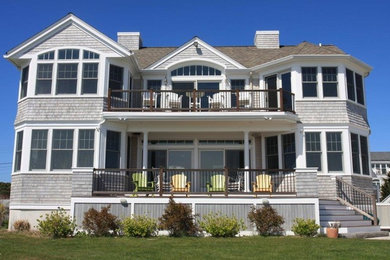 Example of a beach style home design design in Boston