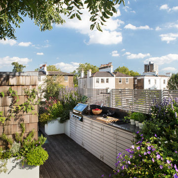 The kitchen is conveniently positioned opposite the dumb waiter which is clad in