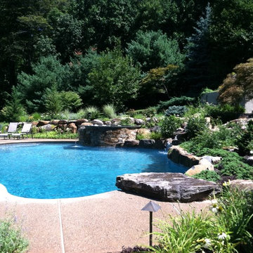 Upper Saucon Township custom built pool with raised spa, waterfall, & boulders