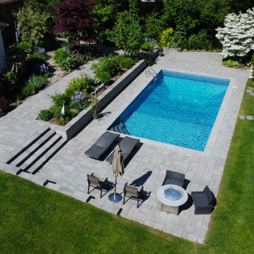 Elevating the Backyard with Interlocking Pool Deck and Garden Oasis