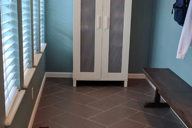 Mid-sized trendy ceramic tile and gray floor mudroom photo in Seattle with blue walls