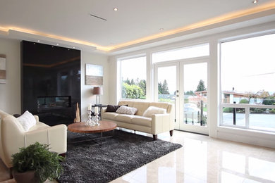 Inspiration for a large modern formal and enclosed marble floor living room remodel in Vancouver with white walls, a standard fireplace, a stone fireplace and a wall-mounted tv