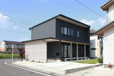 Imagen de fachada de casa de dos plantas con tejado de un solo tendido