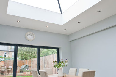 Photo of a modern dining room in Surrey.