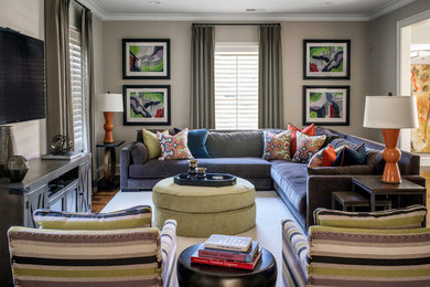 Large transitional family room in Atlanta with grey walls.