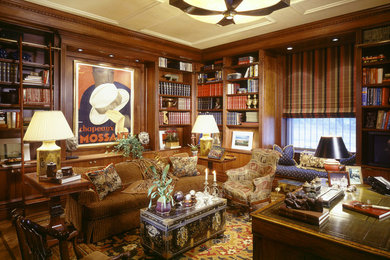 Example of a classic freestanding desk medium tone wood floor home office design in New York