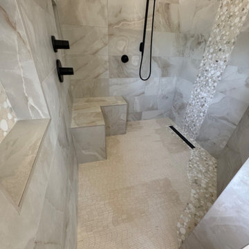 Curd-less walk-in shower; heated floors in bathroom + shower+bench LED