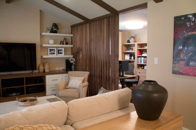 Living room - mid-sized contemporary open concept dark wood floor, red floor and exposed beam living room idea in San Francisco with no fireplace and a media wall