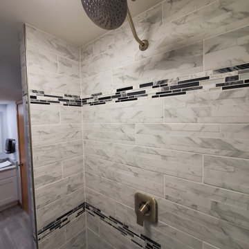 Finished basement shower with extra tall shower head