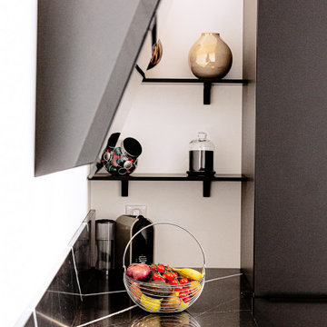 Cuisine noire avec plan de travail en Quartz