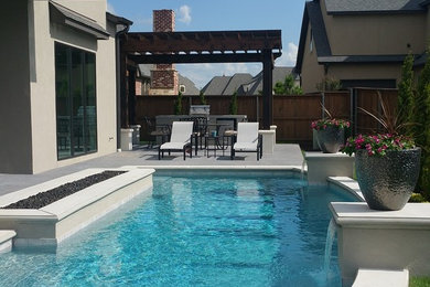 Pool fountain - large contemporary backyard concrete and rectangular lap pool fountain idea in Other