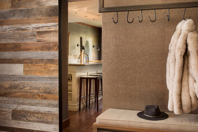 Mudroom - small contemporary dark wood floor mudroom idea in Denver with brown walls