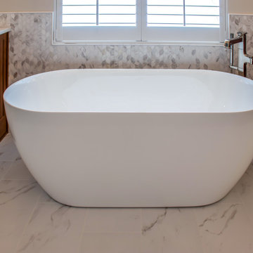 Luxury Spa Bathroom with Natural Warm Vanities, Quartz Countertop, Tiled Shower