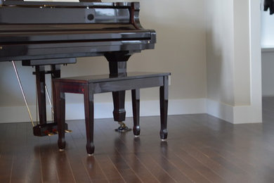 Inspiration for a mid-sized transitional open concept dark wood floor living room remodel in Other with a music area and gray walls
