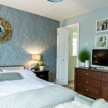 Contemporary Teal Master Bedroom with Gold Accents