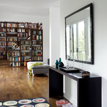 dark floors, books, white walls