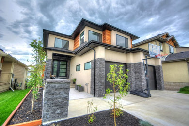 Inspiration for a mid-sized modern multicolored two-story mixed siding exterior home remodel