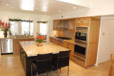 Inspiration for a large contemporary u-shaped ceramic tile eat-in kitchen remodel in Los Angeles with a single-bowl sink, shaker cabinets, light wood cabinets, granite countertops, beige backsplash, ceramic backsplash, stainless steel appliances and an island