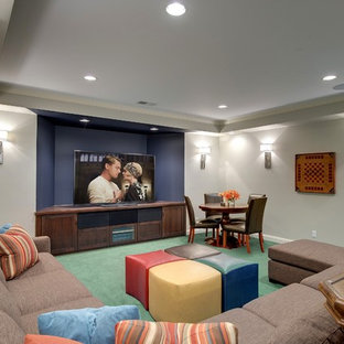 Traditional fully buried basement in Minneapolis with grey walls, carpet, no fireplace and turquoise floors.