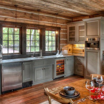 Weathered Antique Flooring, Paneling, and Timbers in a Rustic Cabin Kitchen