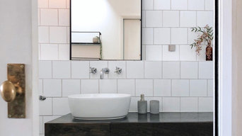 Monochrome bathroom, sleek and modern warmed by real wood, natural touches and a