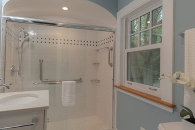 Mid-sized elegant white tile and subway tile mosaic tile floor, white floor and single-sink bathroom photo in Chicago with shaker cabinets, white cabinets, a two-piece toilet, blue walls, an undermount sink, quartz countertops, white countertops and a built-in vanity