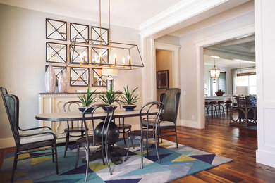 Mid-sized minimalist medium tone wood floor enclosed dining room photo in San Diego with white walls