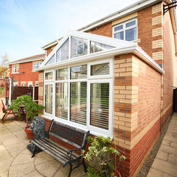 White Conservatory with PVCu Bi-Fold Doors - Products