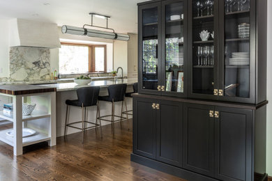 Large transitional l-shaped dark wood floor and brown floor eat-in kitchen photo in Philadelphia with an undermount sink, shaker cabinets, beige cabinets, marble countertops, white backsplash, marble backsplash, paneled appliances, an island and white countertops