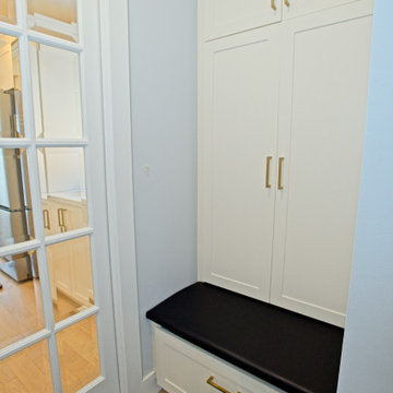 Built-In Mudroom Bench with Tall White Storage Cabinets | The Junction