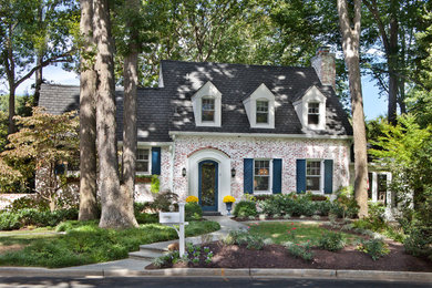 Elegant brick exterior home photo in DC Metro