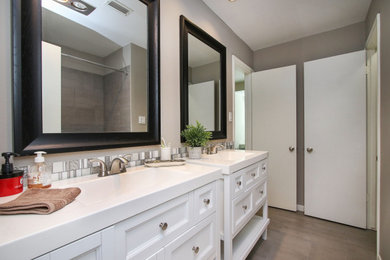 Bathroom - mid-sized traditional kids' gray tile ceramic tile, gray floor and double-sink bathroom idea in Other with shaker cabinets, white cabinets, gray walls, an integrated sink, marble countertops, white countertops and a freestanding vanity