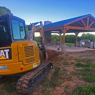 Pavilion being built to hold the outdoor fireplace, kitchen, and living area.