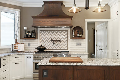 Enclosed kitchen - large traditional u-shaped ceramic tile enclosed kitchen idea in Ottawa with a farmhouse sink, raised-panel cabinets, white cabinets, granite countertops, white backsplash, ceramic backsplash, stainless steel appliances and an island
