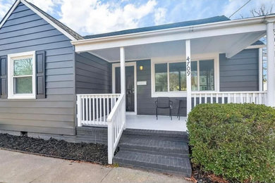 This is an example of a cottage porch design in Miami.