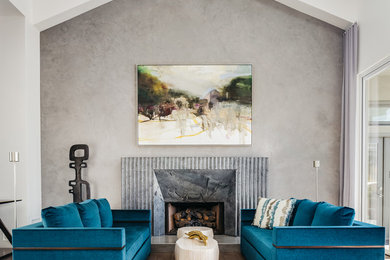 Example of a large transitional formal and open concept medium tone wood floor and brown floor living room design in San Francisco with gray walls, a standard fireplace, a metal fireplace and no tv