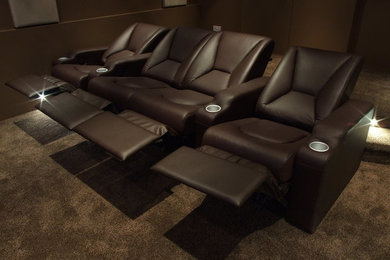 Design ideas for a mid-sized home theatre in London.