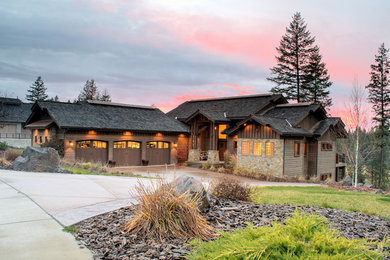 Inspiration for a large craftsman brown two-story wood gable roof remodel in Seattle