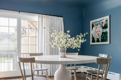 Elegant dining room photo in Chicago with blue walls
