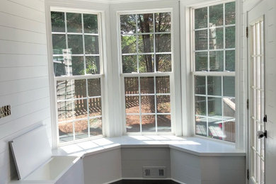 Inspiration for a small cottage dark wood floor and brown floor hallway remodel in Charlotte with white walls