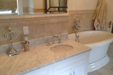 Design ideas for a traditional master bathroom in Providence with a claw-foot tub and an undermount sink.