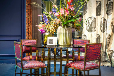 Eclectic dining room photo in Amsterdam with blue walls