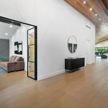 Hall Opening Into the Great Room and Rear Glazing