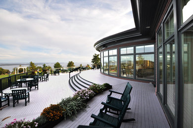 Inspiration for a huge transitional backyard deck remodel in Boston with no cover