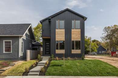 Mid-sized minimalist black two-story wood exterior home photo in Indianapolis with a shingle roof