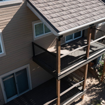 Two-Story Composite Deck With Privacy Wall and Covered Patio