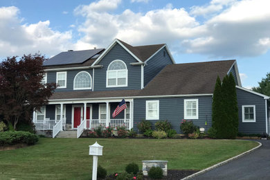 Example of a country exterior home design in New York