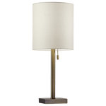 Adesso - Liam Table Lamp - The Liam Table Lamp is an elegant style that highlights simple materials and a classic silhouette. A thick antique brass metal pole supports a light beige textured fabric shade. A tall cylinder shade is contrasted by a compact square shaped metal base. A simple pull chain turns the lamp on and off. A subtle clear cord trails out from the base. Set this table lamp on your nightstand for a soft, modern look.