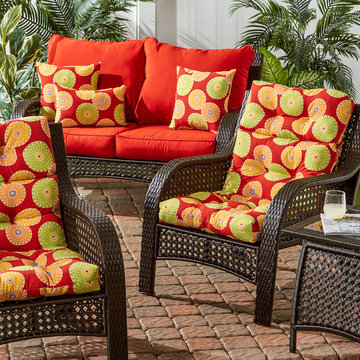 Wicker Woven Lounge Set with Bold Reds and Cicular Pattern Cushions