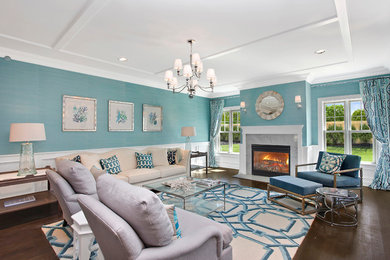 Inspiration for a large coastal open concept and formal dark wood floor and brown floor living room remodel in New York with blue walls, a standard fireplace, no tv and a stone fireplace